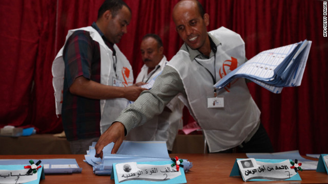 Election officials begin sorting ballots at a polling station in Tajura following Libya's General National Assembly election.