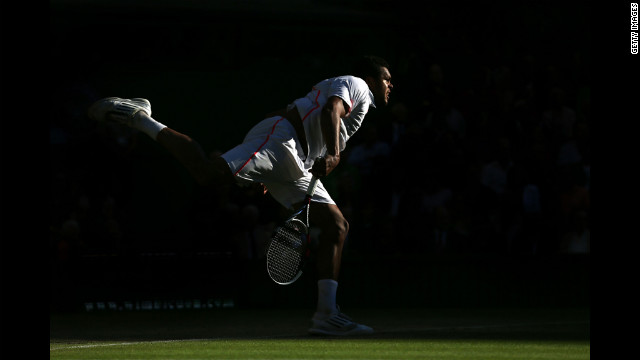 France's Jo-Wilfried Tsonga serves the ball during his Gentlemen's Singles semifinal match against Andy Murray of Great Britain.