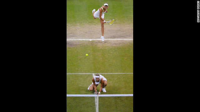 Czech Republic's Lucie Hradecka crouches as Andrea Hlavackova serves during their women's doubles final match against Venus and Serena Williams. 