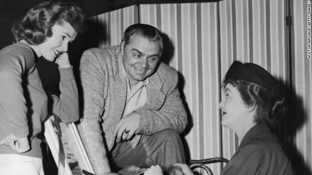 Debbie Reynolds, left, and Borgnine chat with Bette Davis on the set of the 1956 Richard Brooks' film 