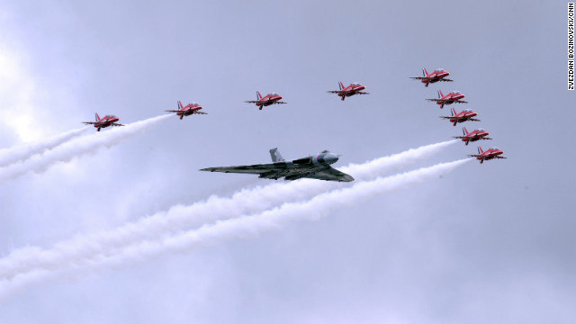 The RAF Red Arrows take to the skies with the last remaining flying Vulcan for a flypast to open the week's aviation festivities. 