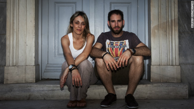 Maria Papanagiotaki and Aristotle Skalizos, part of Greece's young professional class. They have been dating for more than two years but have different views on whether to stay in Greece or leave for opportunities elsewhere.