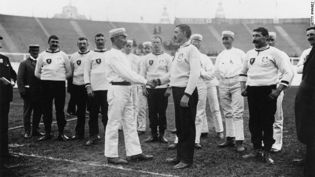 Captains of the Swedish and English tug-of-war teams shake hands at the tournament held in Crystal Palace. 