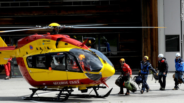 An emergency services rescue crew board an helicopter in Chamonix, to fly to the Mont Maudit in the French Alps.