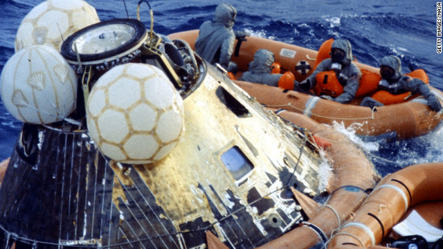 After the capsule was stabilized, the astronauts and SEALs put on biological isolation garments to guard against possible lunar pathogens. If the SEALs had been been directly exposed to the astronauts, they would have been ordered to be quarantined.