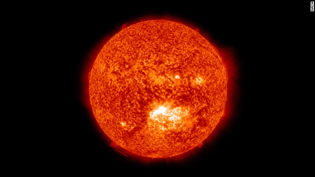 This image from the Solar Dynamics Observatory shows the sun at 12:45 p.m. ET on July 12, 2012, during an X1.4 class flare. The image is captured in the 304 Angstrom wavelength, which is typically colorized in red. 