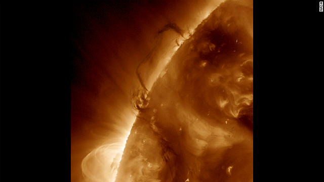 Two areas of dark plasma that were close together danced and entwined with each other over a one-day period March 27-28, 2012. The dark plasma, seen in profile, was somewhat cooler and therefore darker than the material around it. 