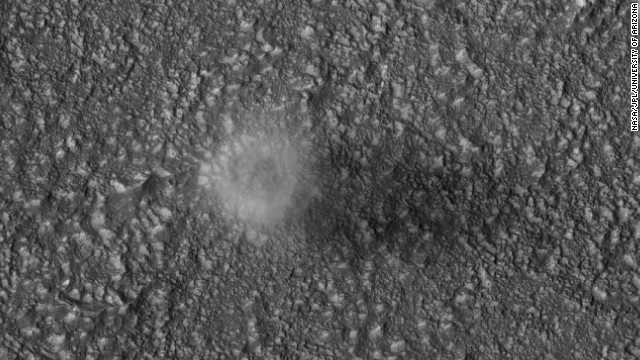 The Mars Reconnaissance Orbiter captures a dust devil blowing across the Martian surface east of the Hellas impact basin in 2007. Dust devils form when the temperature of the atmosphere near the ground is much warmer than that above. The diameter of this dust devil is about 200 meters (650 feet).