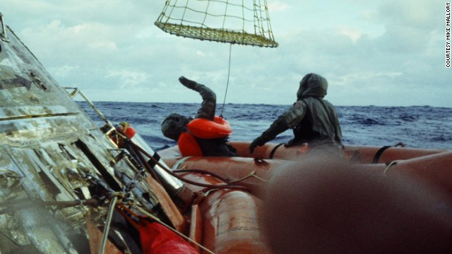 Hatleberg helped the astronauts climb into a "Billy-Pugh net" which was used to hoist them into a Navy chopper hovering above.