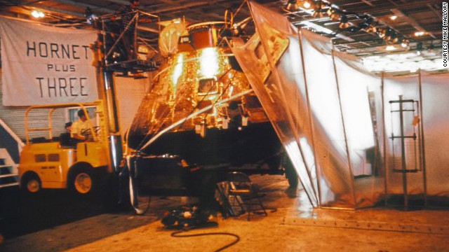 The capsule hatch was locked and sealed before the spacecraft was hoisted aboard the Hornet and kept in its own quarantine area, just in case. "We all took strips of that gold foil as souvenirs," said Wolfram.