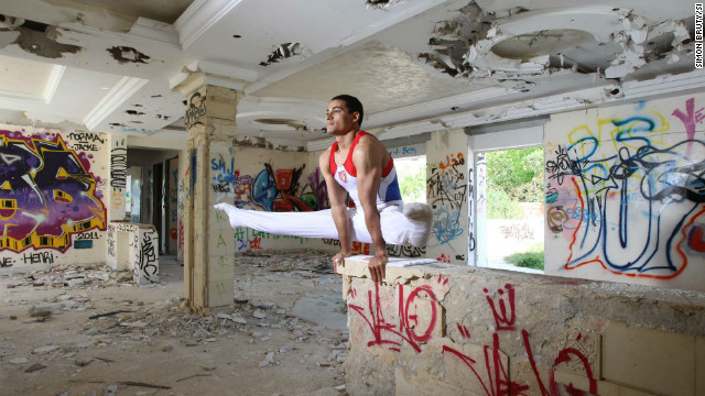 In 2009 the Tunisian gymnast Wajdi Bouallegue was banned by the government from competing internationally. His crime was to tear up a picture of the now deposed leader Zine al Abidine Ben Ali. Here he is pictured in the shell of the former home of Ben Ali's brother-in-law.