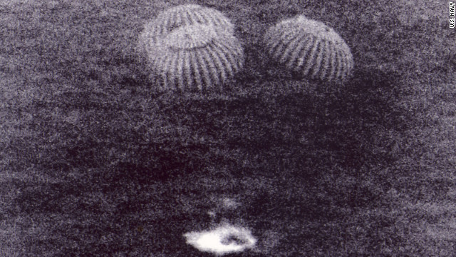 In this U.S. Navy photo, Apollo 11 splashes down about 1,000 miles off Hawaii. It was the exact moment when America achieved President Kennedy's goal to land a man on the moon and return him to Earth, says Scott Carmichael, author of "Moon Men Return." "It's one thing to get the astronauts to the moon, but you've got to bring them back alive."