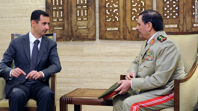 A picture released by the official Syrian Arab News Agency on July 19 shows Syrian General Fahd al-Freij meeting with President Bashar al-Assad in Damascus after his swearing-in ceremony as defense minister. 