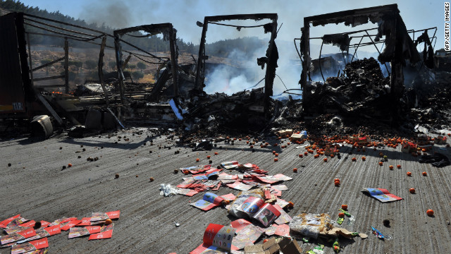 Burned-out trucks at the Bab al-Hawa Syrian border post with Turkey on Friday, July 20. Syrian rebels seized control of the post after a fierce battle with Syrian troops, an AFP photographer at the scene reported.