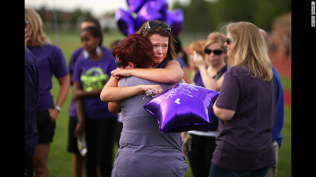 Family, friends and former classmates of movie theater shooting victim A.J. Boik gather for a memorial service at Gateway High School on Saturday.