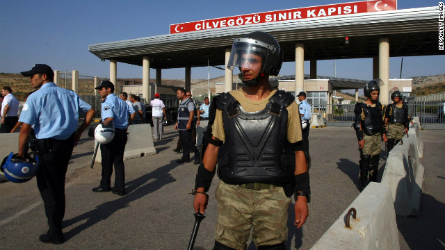 Turkish soldiers stand guard at the Cilvegozu border gate in Reyhanly that connects to Syria's Bab al-Hawa post. An estimated 120,000 people have fled Syria to Turkey, Iraq, Lebanon and Jordan.