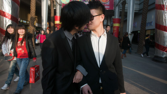 In a picture taken on March 8, 2011, a gay couple kiss during their ceremonial 'wedding' to raise awareness of the issue of homosexual marriage, in Wuhan, in central China's Hubei province. 