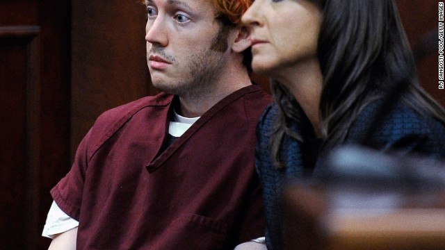 The public gets its first glimpse of James Holmes, 24, the suspect in the Colorado theater shooting during his initial court appearance Monday, July 23. With his hair dyed reddish-orange, Holmes, here with public defender Tamara Brady, showed little emotion. He is accused of opening fire in a movie theater Friday, July 20, in Aurora, Colorado, killing 12 people and wounding 58 others. More photos: Mourning the victims of the Colorado theater massacre