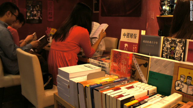 Customers sit and read books on Chinese politics inside People's Commune in Causeway Bay, Hong Kong.