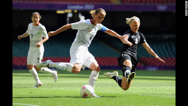 Casey Stoney of Great Britain goes up against Katie Hoyle of New Zealand.