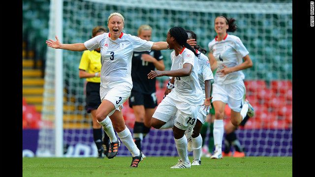 Britain's Stephanie Houghton celebrates a goal, adding the first point to the scoreboard, with teammate Ifeoma Diek.