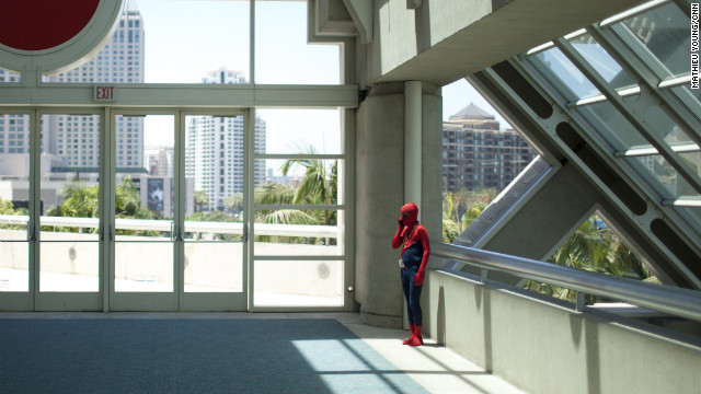 Spider-Man takes a call in a quiet corner of the San Diego Convention Center.