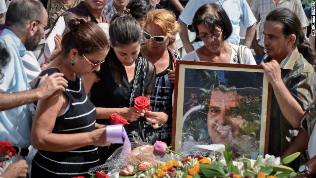 Ofelia Acevedo (left), widow of Oswaldo Paya, and their daughter, Rosa Maria, attend his funeral on Tuesday in Havana.