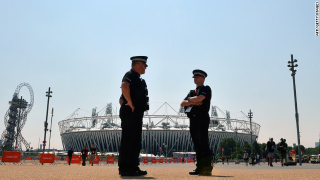 Security personnel patrol in front of Olympic Park in London on Thursday, a day ahead of the opening ceremony. Security concerns surfaced when a private contractor failed to provide enough staff. As a result, the government is deploying 18,200 troops to remedy the shortfall.