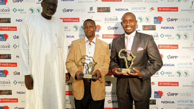 Kenyan journalist Nimrod Taabu Mwagamoyo poses with joint winner Charles Kinyua Kariuki after they receive the award for Television News Bulletin. 