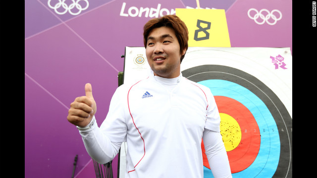 South Korean archer Im Dong Hyun celebrates breaking the first world record of the London Olympics on Friday. The two-time gold medalist, who is classified as legally blind and can't see out of his right eye, bettered his own 72-arrow mark in the qualification competition.