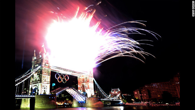 Fireworks explode from the top of Tower Bridge.