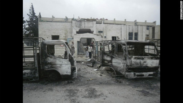 Fighting leaves vehicles damaged Saturday in the southwestern city of Daraa.