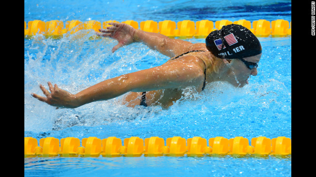 Vollmer set a world record in winning the 100-meter butterfly, becoming the first woman to go under 56 seconds.