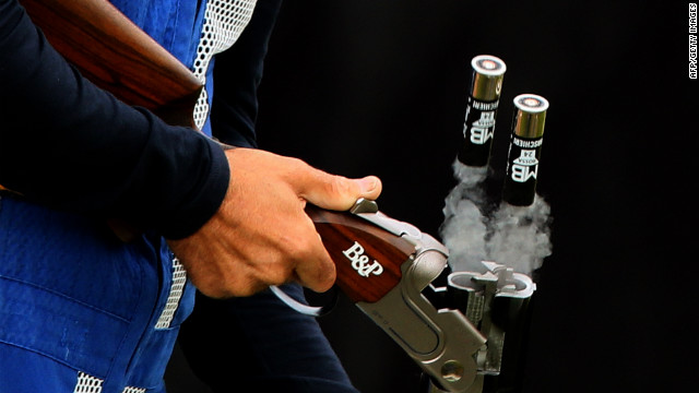 Italy's Ennio Falco removes cartridges as he competes in the men's skeet shooting qualification round Tuesday.