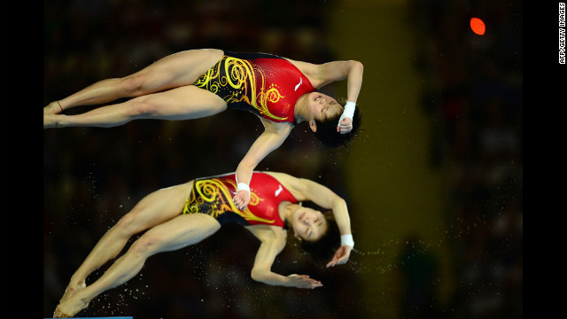 China's Chen Ruolin and Wang Hao compete in the women's synchronized 10-meter platform final. They won a gold for their performance. 