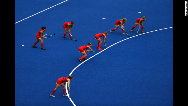 The Belgian team lines around the D for a penalty corner during their women's field hockey match against China.