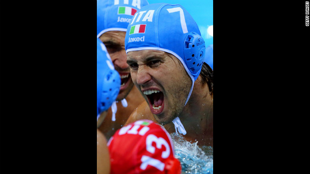 Massimo Giacoppo of Italy motivates his teammates before a water polo match against Greece.