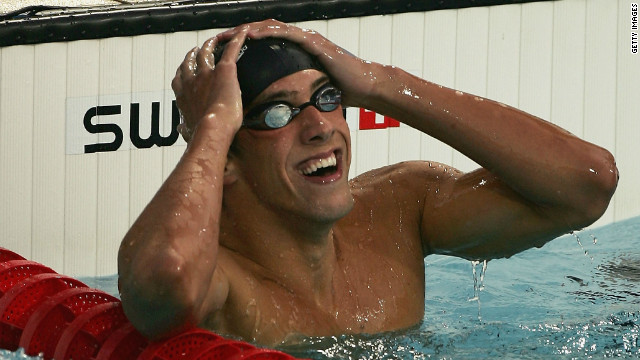 Phelps of the United States celebrates winning gold in the men's swimming 400-meter individual medley final on August 14, 2004. 