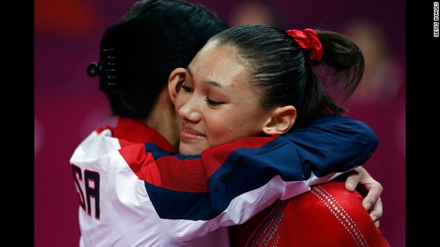 American Kyla Ross and coach Jenny Zhang hug during the women's gymnastics team final Tuesday.
