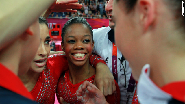 Gabrielle Douglas of the United States celebrates with teammates during the gymnastics women's team final.