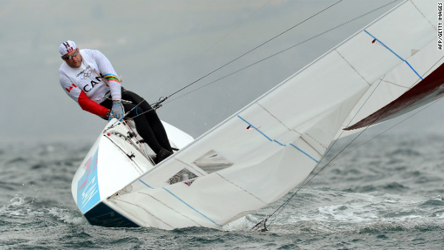 Canada's Tyler Bjorn (shown) and Richard Clarke struggle to keep their keelboat upright in the star sailing class in Weymouth, England.