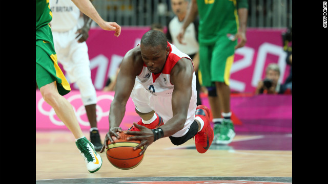 Luol Deng of Great Britain dives for the ball in the men's basketball preliminary match between Great Britain and Brazil.