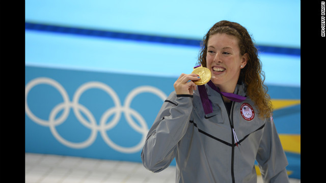 Gold medalist U.S. swimmer Allison Schmitt stands on the podium after the women's 200-meter freestyle final.