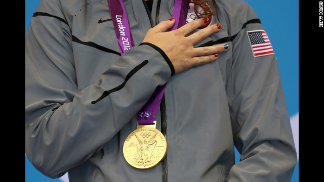 Gold medalist Allison Schmitt poses with her medal. 