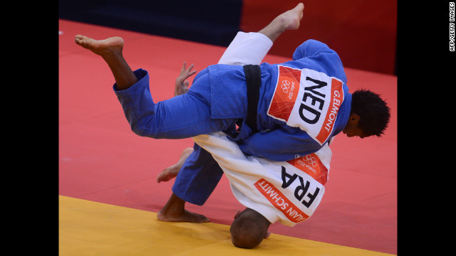 France's Alain Schmitt, in white, competes with the Netherlands' Guillaume Elmont during the men's under 81-kilogram judo contest match Tuesday.