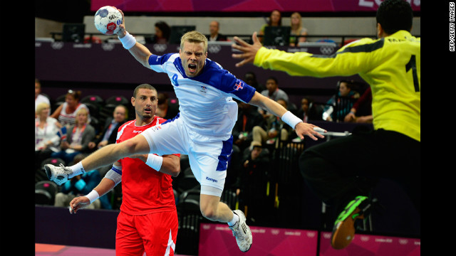 Iceland's Gudjon Valur Sigurdsson jumps to shoot during the men's preliminary handball match against Tunisia on Tuesday.