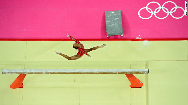 Gabrielle Douglas of the United States performs on the balance beam in the women's gymnastics team final on Day 4 of the London Olympics on Tuesday, July 31. Check out <strong><a href='http://www.cnn.com/2012/07/30/worldsport/gallery/olympics-day-three/' target='_blank'>Day 3 of competition</a></strong> from Monday, July 30. The Games run through August 12. See all the action as it unfolds here.