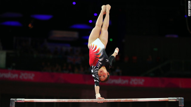 Koko Tsurumi of Japan competes on the uneven bars in the women's gymnastics event.