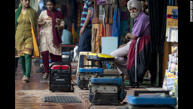 Portable generators provide electrical power to souvenir shops in Janpath Market, a popular tourist shopping area, in New Delhi on Tuesday.