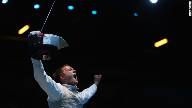 Artur Akhmatkhuzin of Russia celebrates after beating Richard Kruse of Great Britain during a preliminary men's foil match Tuesday.